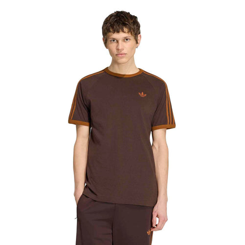 Men's brown T-shirt with orange collar trim and small chest trefoil logo