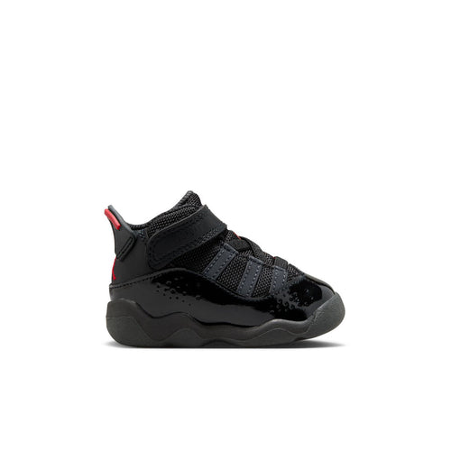 Black toddler sneakers with red accents, hook-and-loop straps, and chunky gray sole.