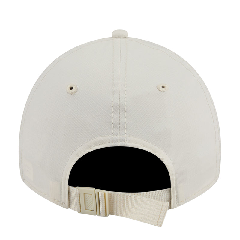 Cream strapback cap back view with black interior and adjustable buckle strap