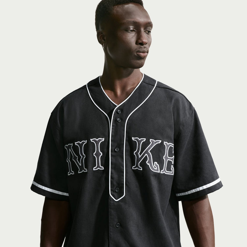 Men's black baseball top with white-trim V-neck placket and large front letters